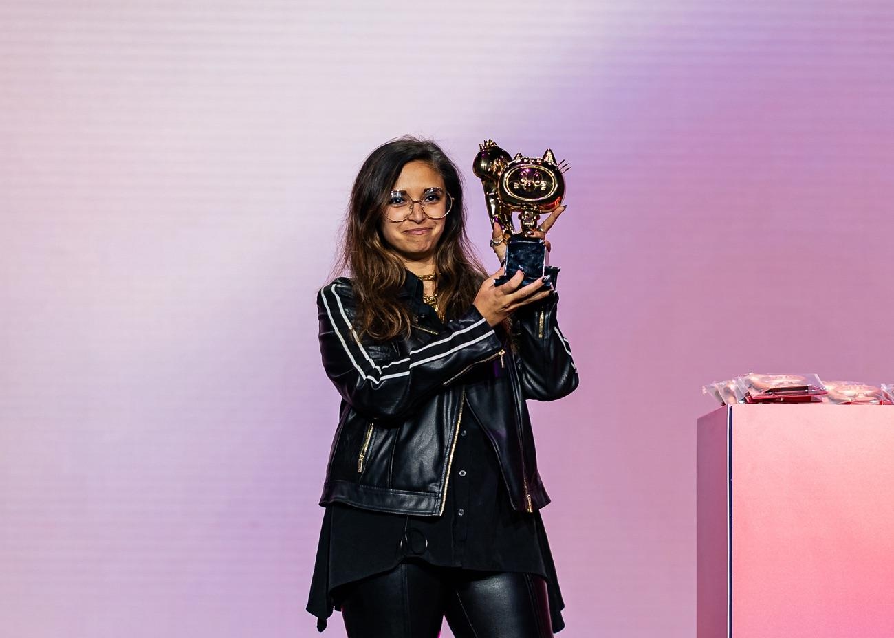 A Shippies winner holding their trophy on stage at the awards ceremony