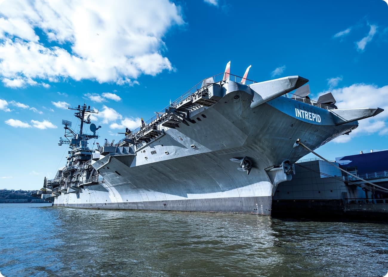The USS Intrepid moored on the Hudson River, its flight deck lined with aircraft